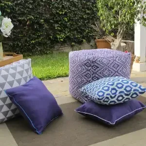 Tropical-themed outdoor cushions on a patio
