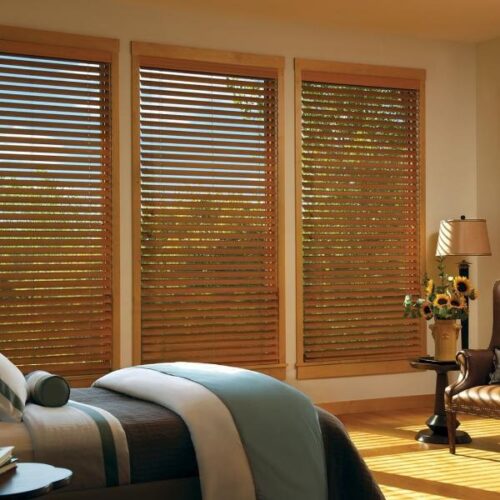 Natural oak wooden blinds in a sunlit living room